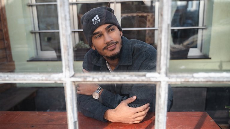 How we champion sustainability Man looking through a window
