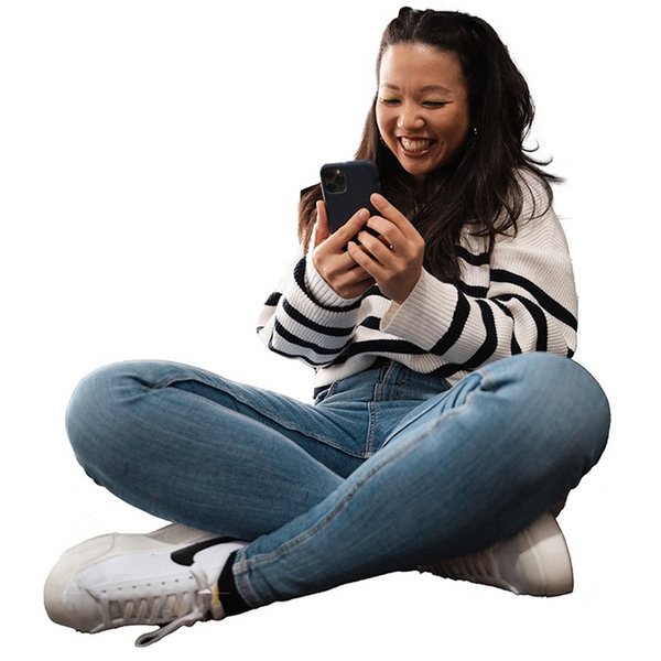 Young woman sitting on the floor with her mobile phone