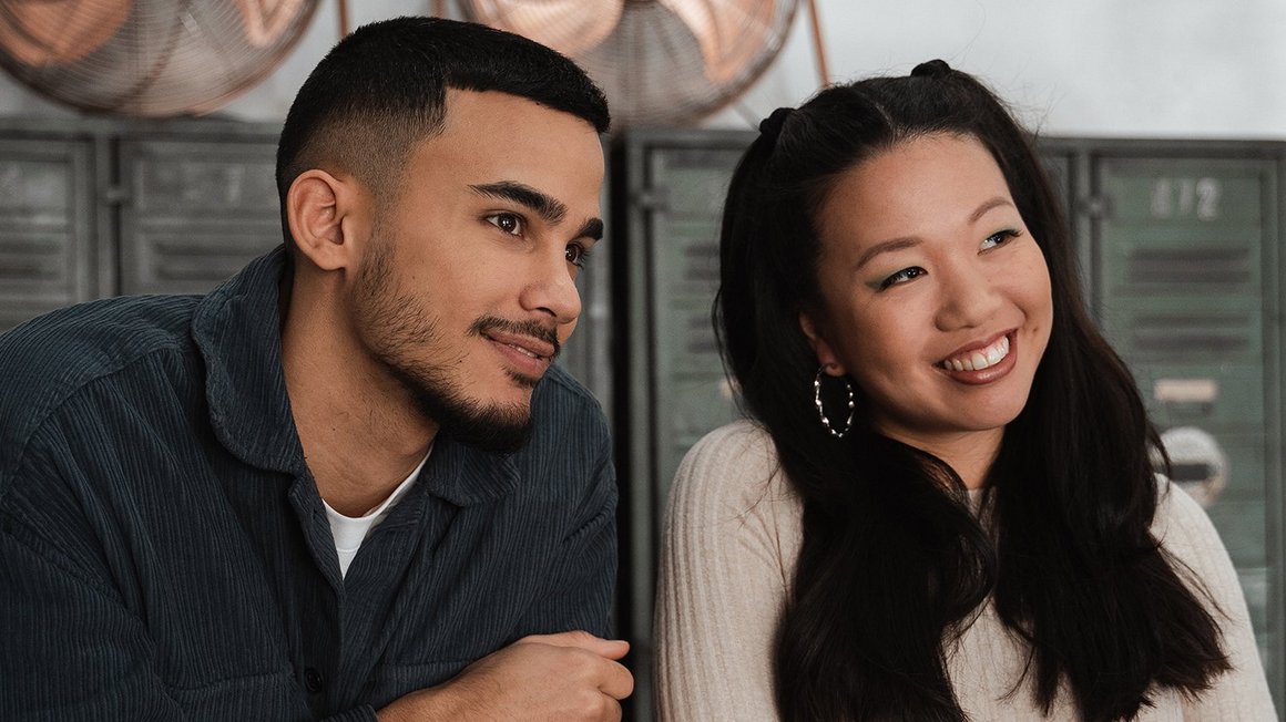 What is a culture of trust? Man and woman standing next to each other smiling